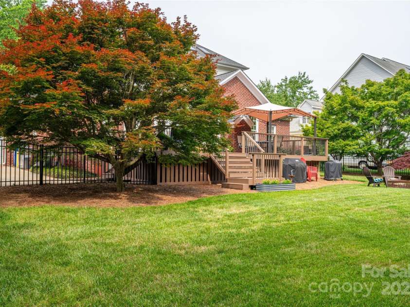 133 Castaway Trail, Mooresville, NC 28117.  MLS# CAR4216721, YatesRealty ID 6111. Back deck and fire pit area