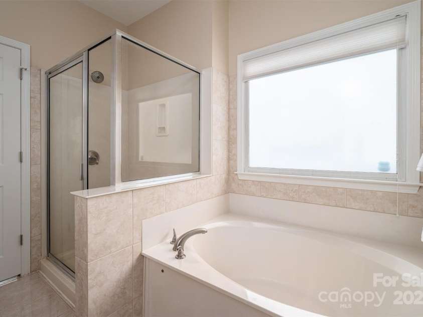 133 Castaway Trail, Mooresville, NC 28117.  MLS# CAR4216721, YatesRealty ID 6111. Secondary bedroom w/floored storage attchd