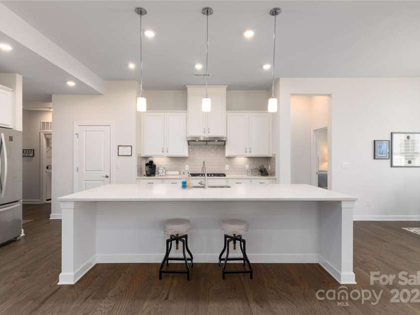 15035 Batteliere Drive, Charlotte, NC 28278.  MLS# CAR4228865, YatesRealty ID 6114. Guests can sit at the island and visit with you.