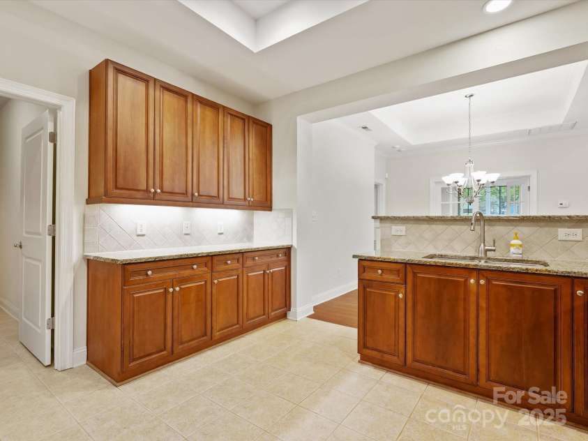 1910 Mezzo Court, Matthews, NC 28105.  MLS# CAR4245911, YatesRealty ID 6115. Awesome countertop space and cabinet storage in this sidebar area