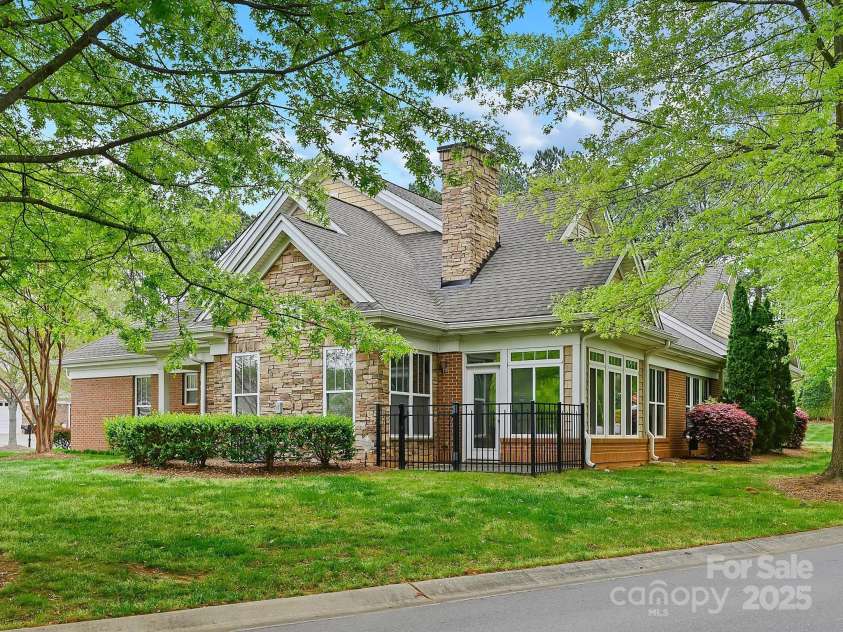 1910 Mezzo Court, Matthews, NC 28105.  MLS# CAR4245911, YatesRealty ID 6115. Gated side porch and back yard area