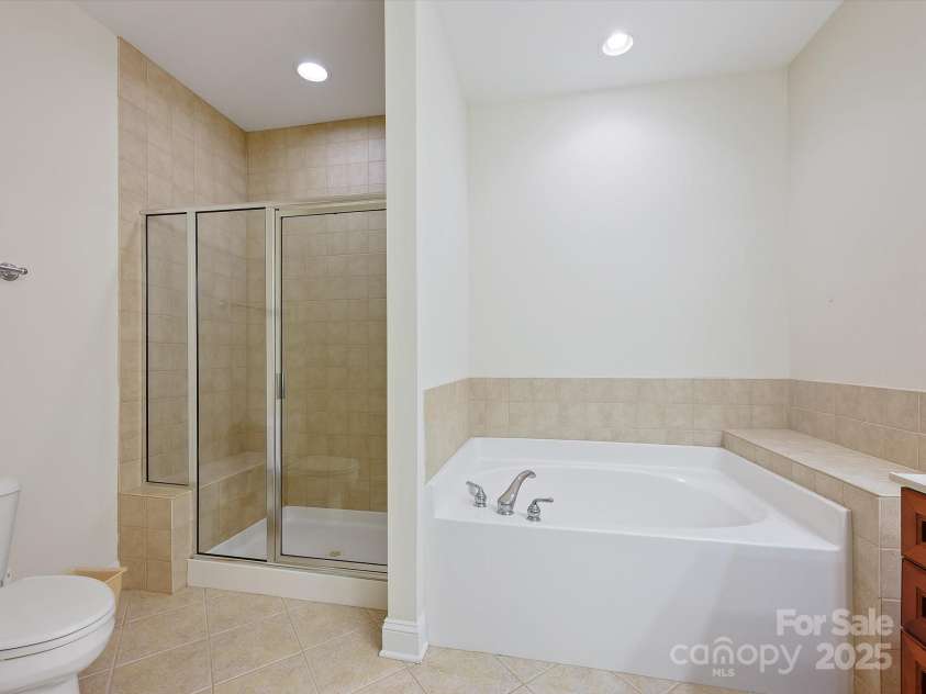 1910 Mezzo Court, Matthews, NC 28105.  MLS# CAR4245911, YatesRealty ID 6115. Primary bath