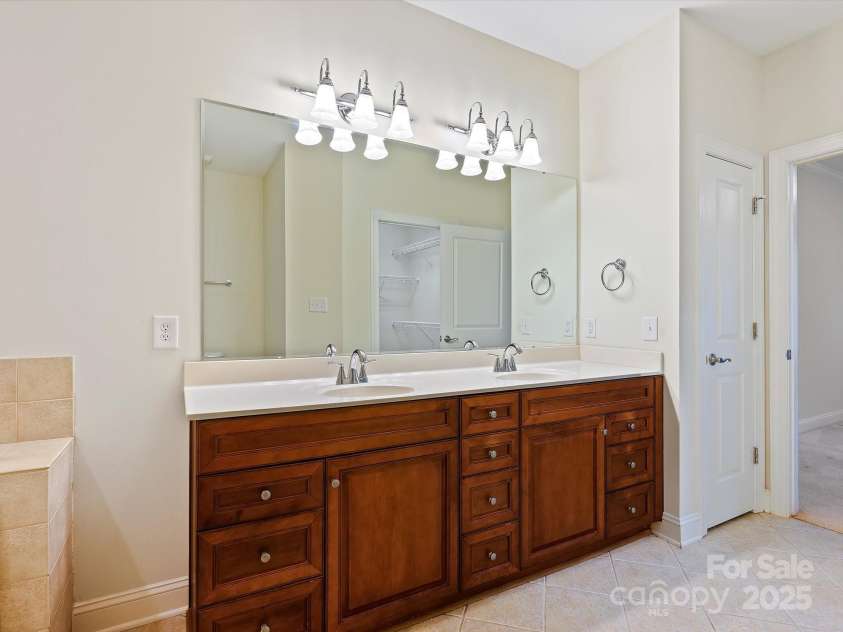 1910 Mezzo Court, Matthews, NC 28105.  MLS# CAR4245911, YatesRealty ID 6115. Primary bath