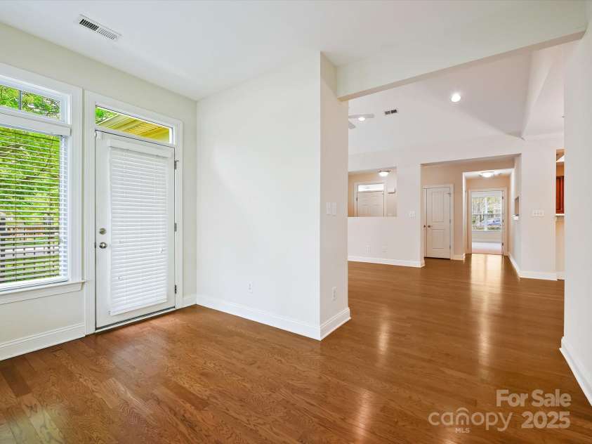 1910 Mezzo Court, Matthews, NC 28105.  MLS# CAR4245911, YatesRealty ID 6115. Sunroom looking into living area