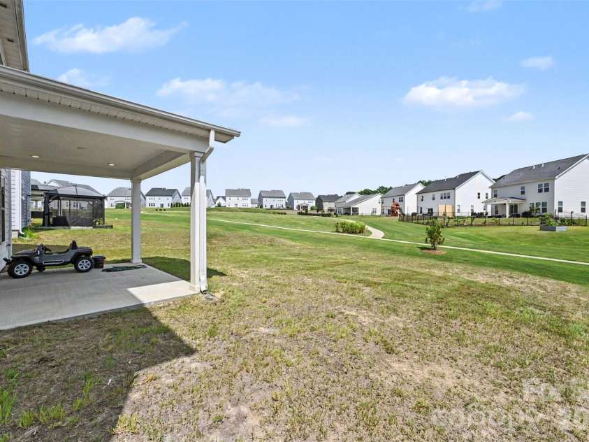 6129 Alsace Lane, Indian Land, SC 29707.  MLS# CAR4398192, YatesRealty ID 6121. Covered back patio and backyard
