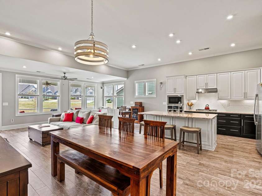 8718 Festival Way, Charlotte, NC 28215.  MLS# CAR4243722, YatesRealty ID 6122. Flooded with natural light, the welcoming Dining Area is perfect for everything from morning coffee and friendly card games to casual wine and cheese gatherings—and it’s equally suited for hosting a fine dinner.