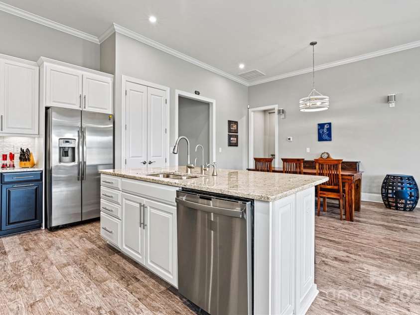 8718 Festival Way, Charlotte, NC 28215.  MLS# CAR4243722, YatesRealty ID 6122. The open layout keeps the Kitchen connected to the Living Area—perfect for staying engaged while entertaining.