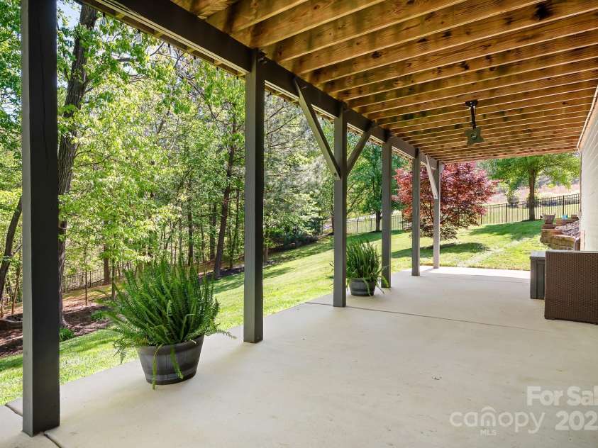 3934 Blue Dory Lane, Denver, NC 28037.  MLS# CAR4240186, YatesRealty ID 6123. Nice shady patio that runs the length of the home