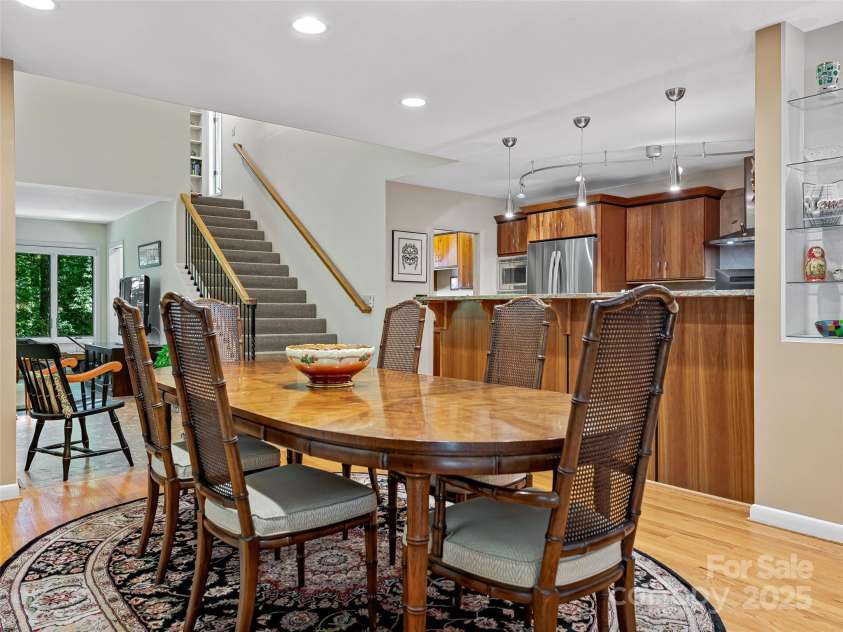 140 Grouse Lane, Brevard, NC 28712.  MLS# CAR4247266, YatesRealty ID 6128. Dining and view to loft-bunk space.