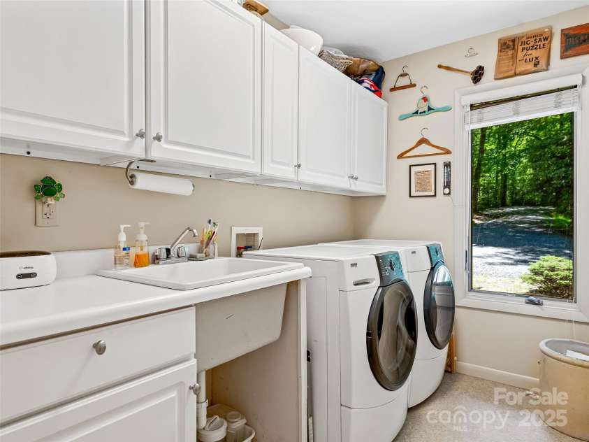140 Grouse Lane, Brevard, NC 28712.  MLS# CAR4247266, YatesRealty ID 6128. Main level laundry room.