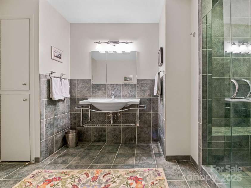 140 Grouse Lane, Brevard, NC 28712.  MLS# CAR4247266, YatesRealty ID 6128. Modern style fixtures.