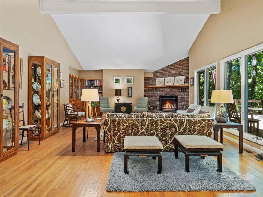 140 Grouse Lane, Brevard, NC 28712.  MLS# CAR4247266, YatesRealty ID 6128. Opens to lakeside deck.