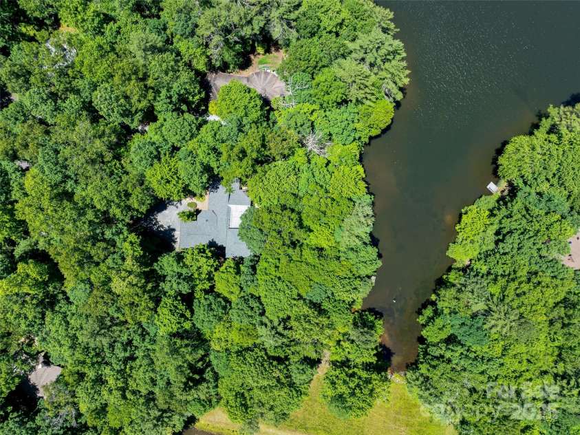140 Grouse Lane, Brevard, NC 28712.  MLS# CAR4247266, YatesRealty ID 6128. Private lakefront.