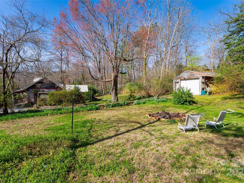 20 Meeks Road, Black Mountain, NC 28711.  MLS# CAR4232565, YatesRealty ID 6129. Fire pit, garage and sideyard