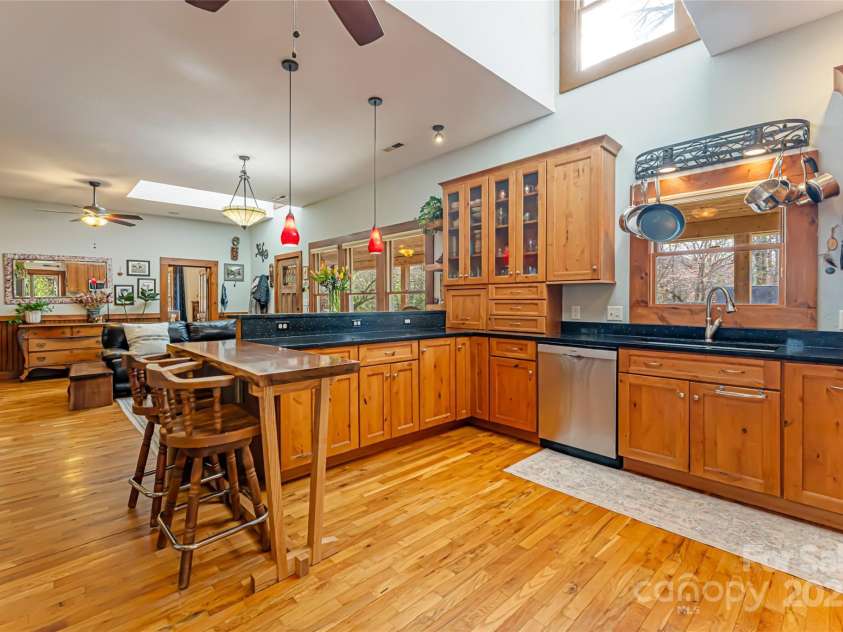 20 Meeks Road, Black Mountain, NC 28711.  MLS# CAR4232565, YatesRealty ID 6129. Kitchen looking into living room