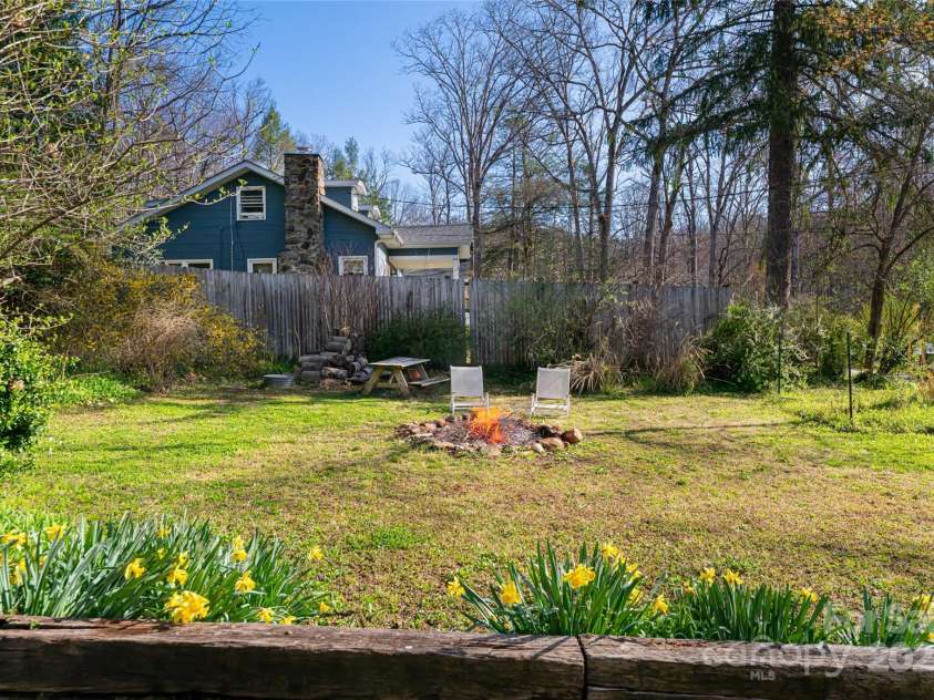 20 Meeks Road, Black Mountain, NC 28711.  MLS# CAR4232565, YatesRealty ID 6129. Side yard with fire pit