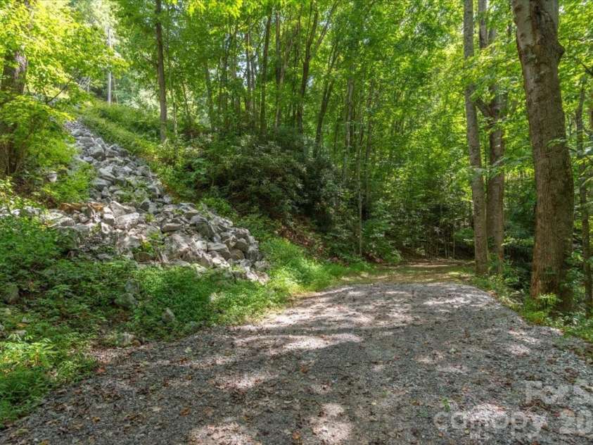 235 Timucua Trail, Waynesville, NC 28786.  MLS# CAR4301389, YatesRealty ID 6129. Adjoining lot offers many options.