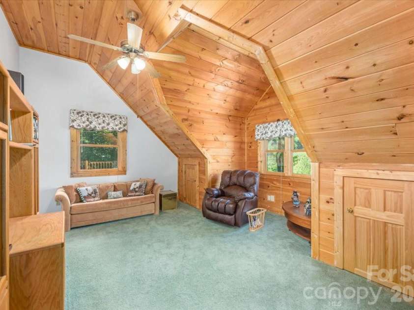 235 Timucua Trail, Waynesville, NC 28786.  MLS# CAR4301389, YatesRealty ID 6129. Comfortable family room.