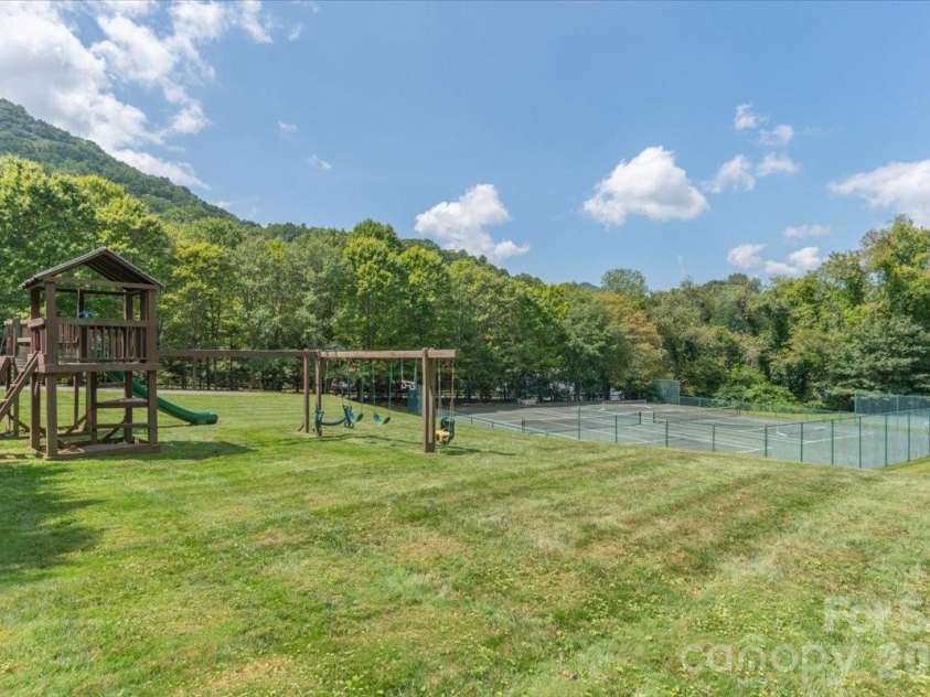 235 Timucua Trail, Waynesville, NC 28786.  MLS# CAR4301389, YatesRealty ID 6129. Community playground, tennis and pickleball courts.