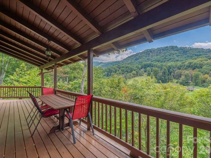 235 Timucua Trail, Waynesville, NC 28786.  MLS# CAR4301389, YatesRealty ID 6129. Entertain and relax on the upper deck. Enjoy the view!