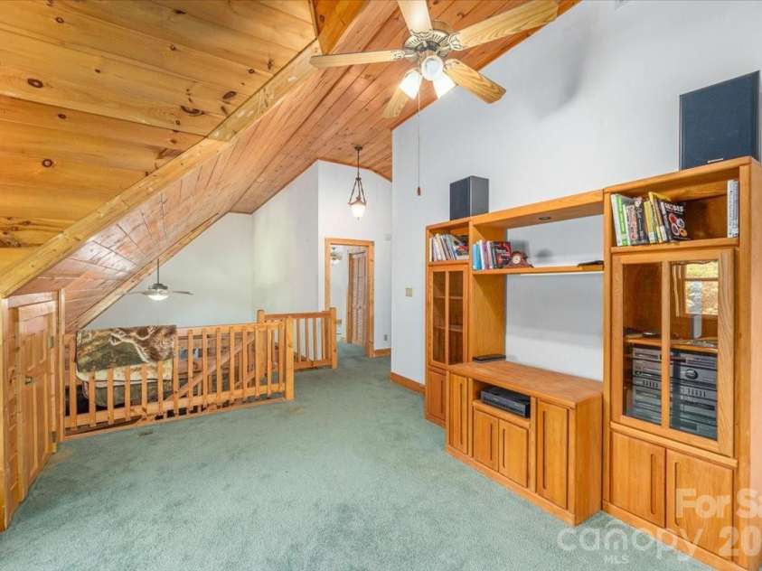 235 Timucua Trail, Waynesville, NC 28786.  MLS# CAR4301389, YatesRealty ID 6129. Entertainment center.