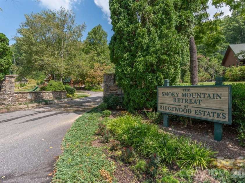235 Timucua Trail, Waynesville, NC 28786.  MLS# CAR4301389, YatesRealty ID 6129. Entrance to Subdivision.