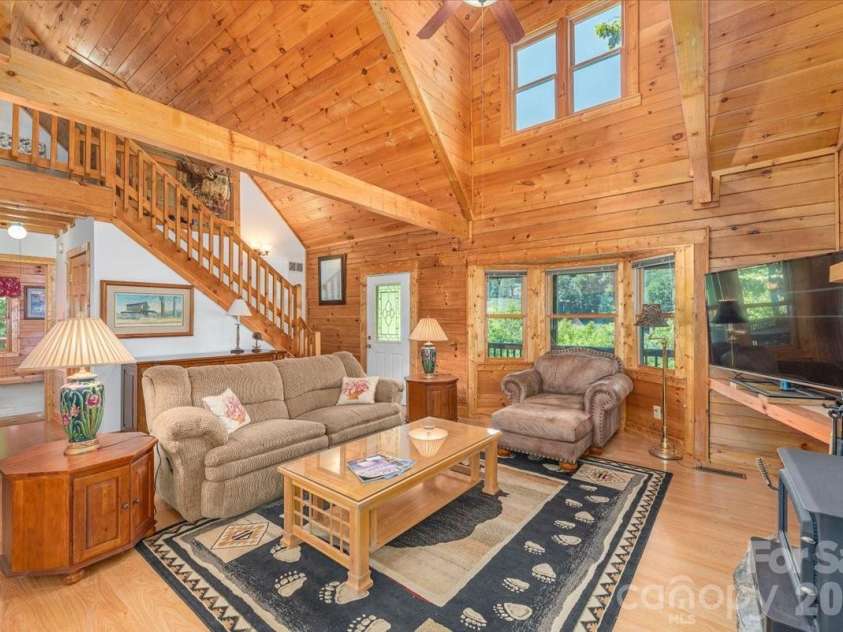 235 Timucua Trail, Waynesville, NC 28786.  MLS# CAR4301389, YatesRealty ID 6129. Great room with vaulted ceiling.