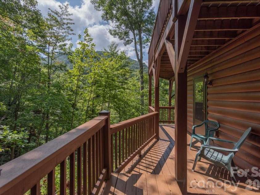 235 Timucua Trail, Waynesville, NC 28786.  MLS# CAR4301389, YatesRealty ID 6129. Lower deck, apartment entrance.