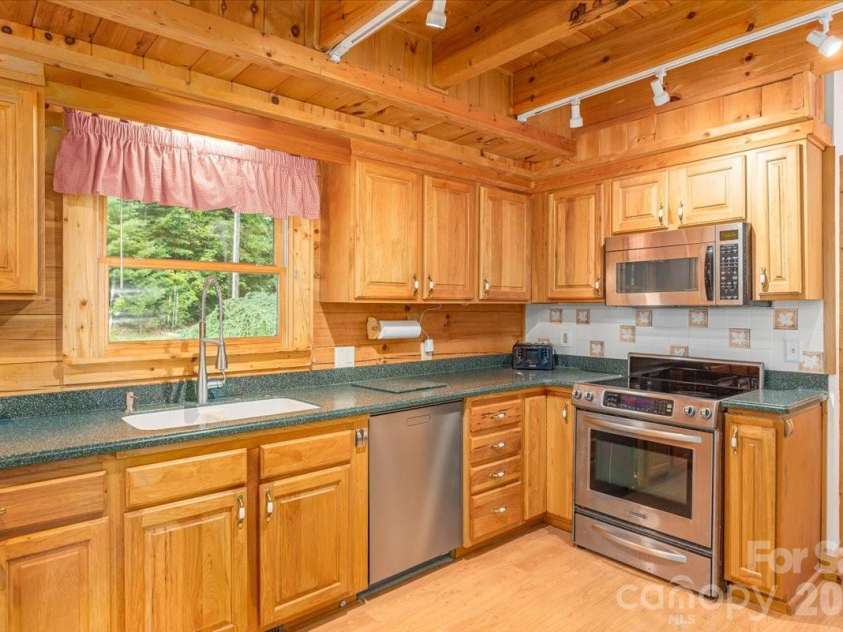 235 Timucua Trail, Waynesville, NC 28786.  MLS# CAR4301389, YatesRealty ID 6129. Plenty of cabinets.