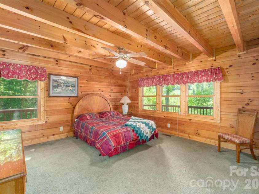 235 Timucua Trail, Waynesville, NC 28786.  MLS# CAR4301389, YatesRealty ID 6129. Spacious Primary bedroom.