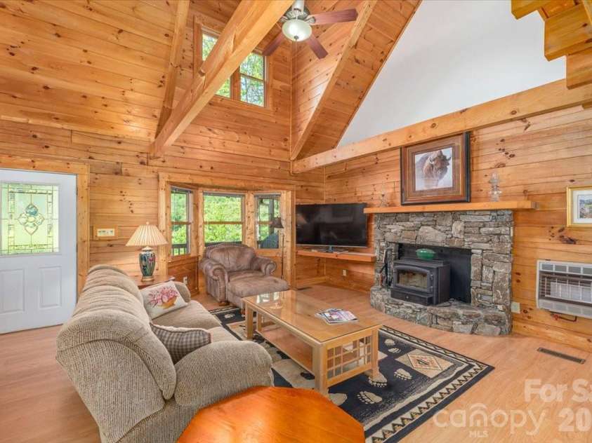 235 Timucua Trail, Waynesville, NC 28786.  MLS# CAR4301389, YatesRealty ID 6129. Stunning stone fireplace.