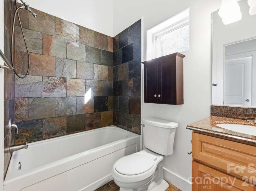 59 Morningside Drive, Asheville, NC 28806.  MLS# CAR4351304, YatesRealty ID 6136. Guest bath on upper level with tub