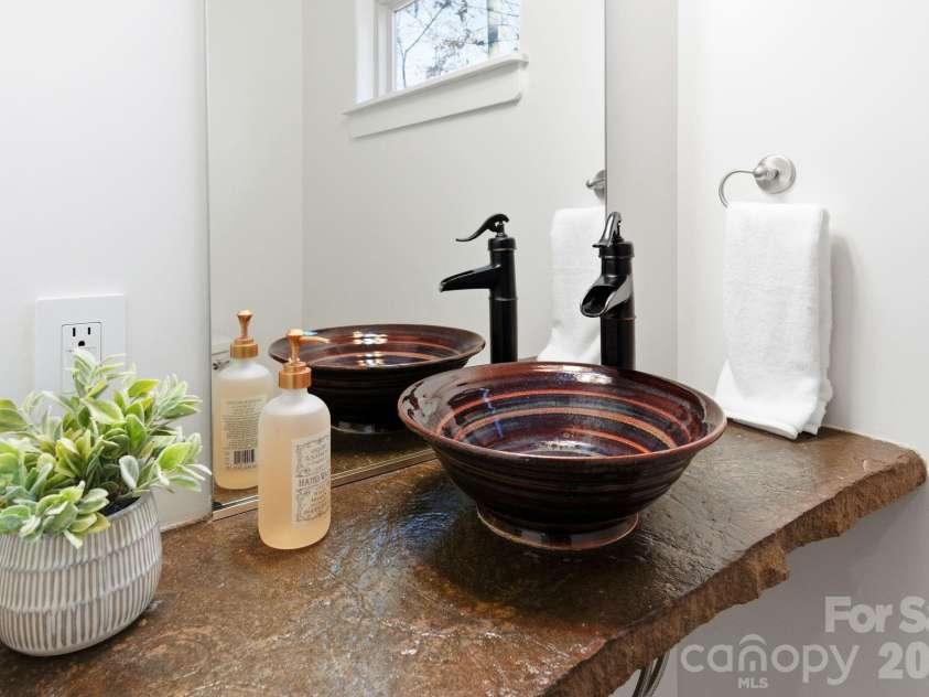 59 Morningside Drive, Asheville, NC 28806.  MLS# CAR4351304, YatesRealty ID 6136. Half bath on main includes artistic sink and counter