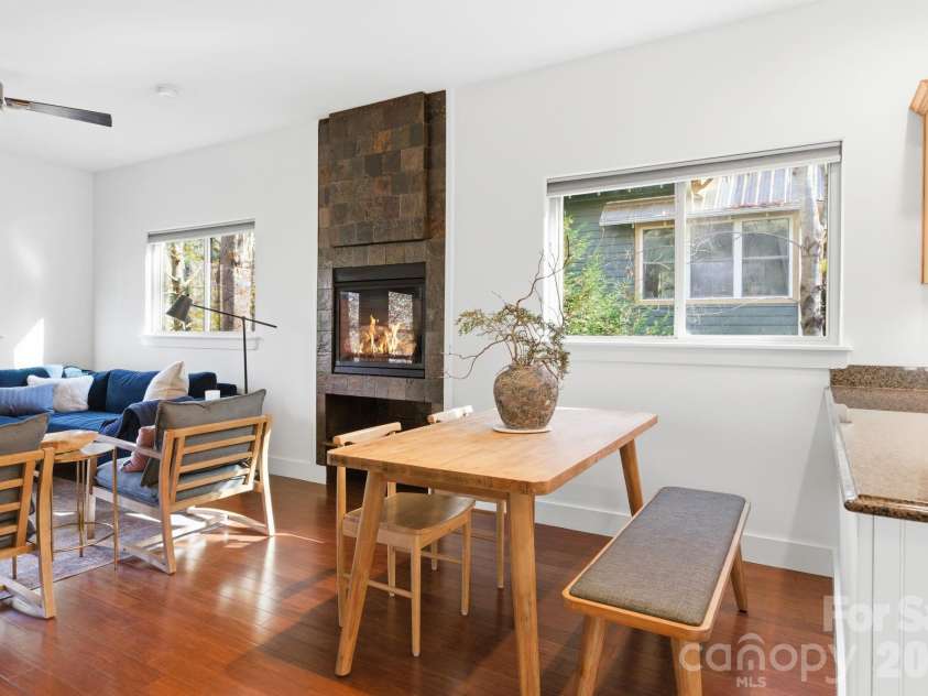 59 Morningside Drive, Asheville, NC 28806.  MLS# CAR4351304, YatesRealty ID 6136. Main level living room off dining area