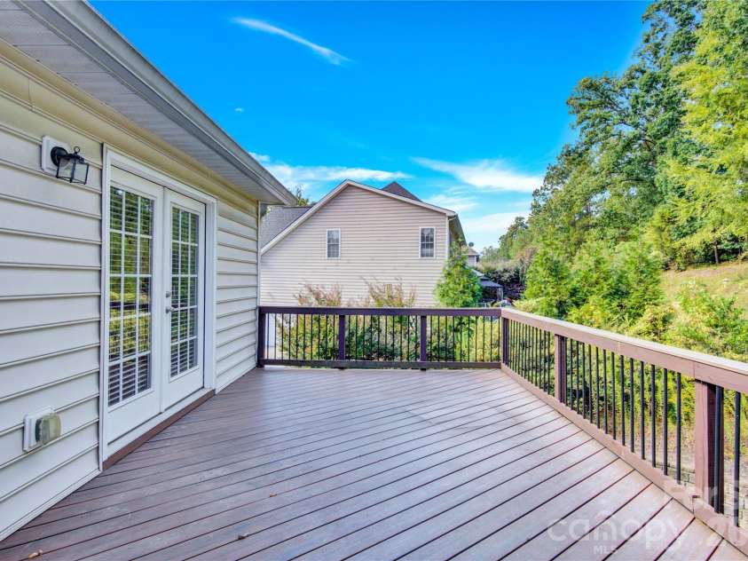 2055 Solway Lane, Charlotte, NC 28269.  MLS# CAR4307419, YatesRealty ID 6138. Deck off Primary Bedroom
