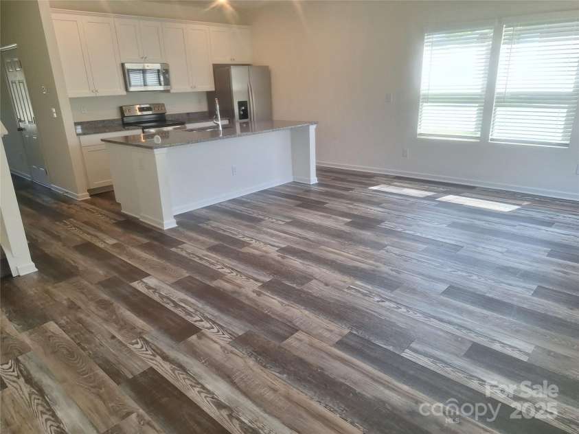 405 Mulberry Street, Cherryville, NC 28021.  MLS# CAR4247167, YatesRealty ID 6139. Kitchen from back inside of family room (same in unit B)