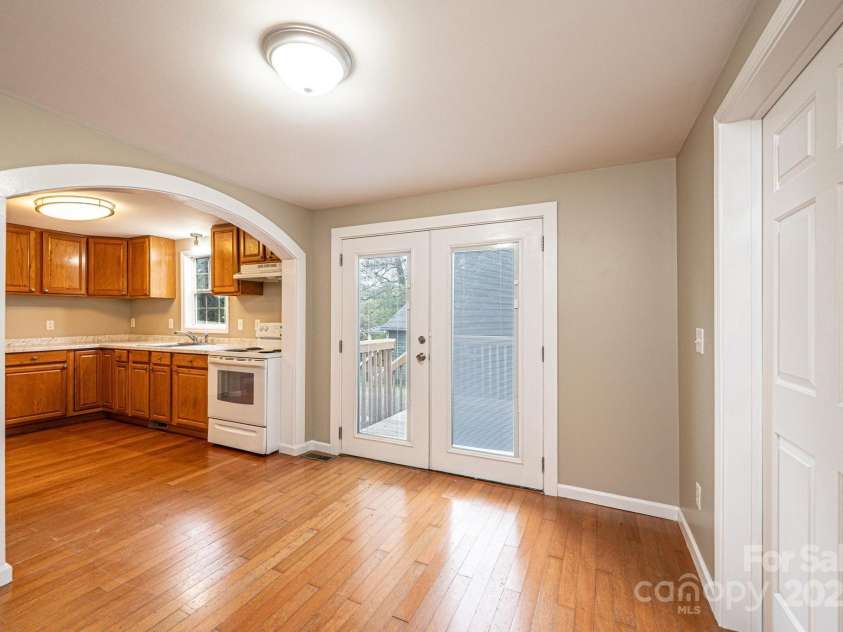 390 15th Avenue, Hickory, NC 28601.  MLS# CAR4245209, YatesRealty ID 6147. Dining area open to kitchen with french doors to deck.