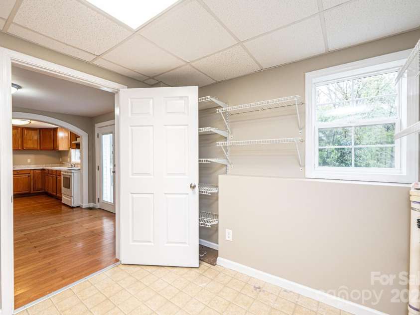 390 15th Avenue, Hickory, NC 28601.  MLS# CAR4245209, YatesRealty ID 6147. Main level laundry room/storage.