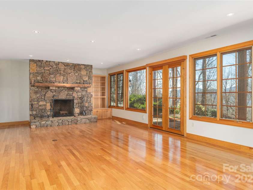 98 Flat Creek Road, Fairview, NC 28730.  MLS# CAR4185540, YatesRealty ID 615. Lower Level Family Room with Exterior Patio