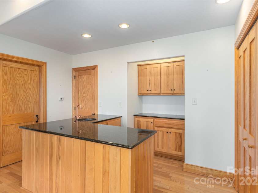 98 Flat Creek Road, Fairview, NC 28730.  MLS# CAR4185540, YatesRealty ID 615. Lower Level Kitchenette 