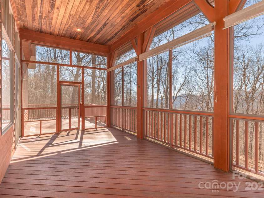 98 Flat Creek Road, Fairview, NC 28730.  MLS# CAR4185540, YatesRealty ID 615. Screened Porch With Southern Views