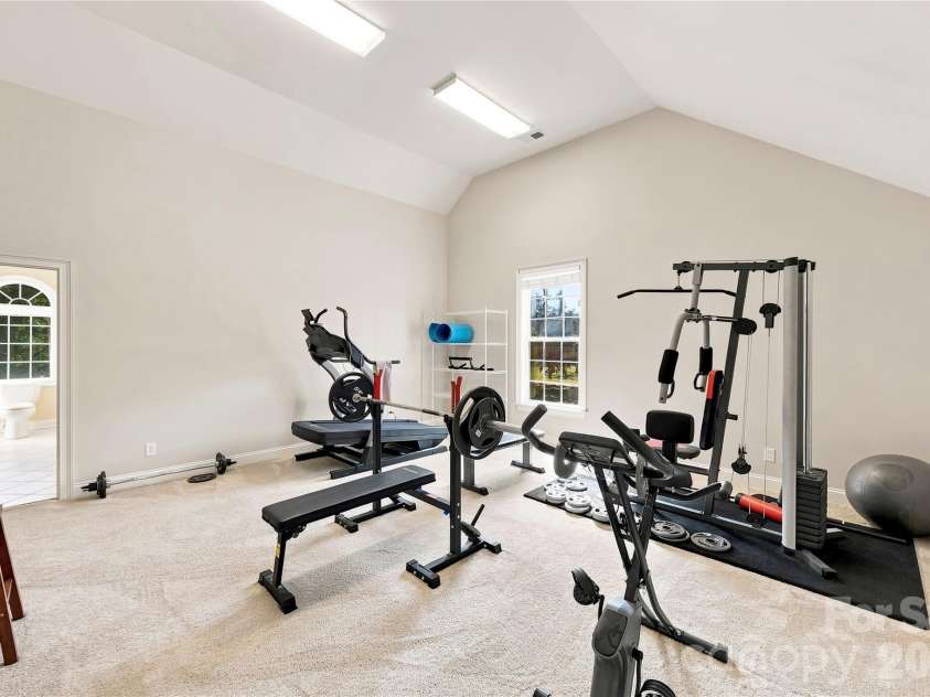 393 Youngs Bend Road, Kershaw, SC 29067.  MLS# CAR4423176, YatesRealty ID 6155. Exercise room with laundry room and additional storage