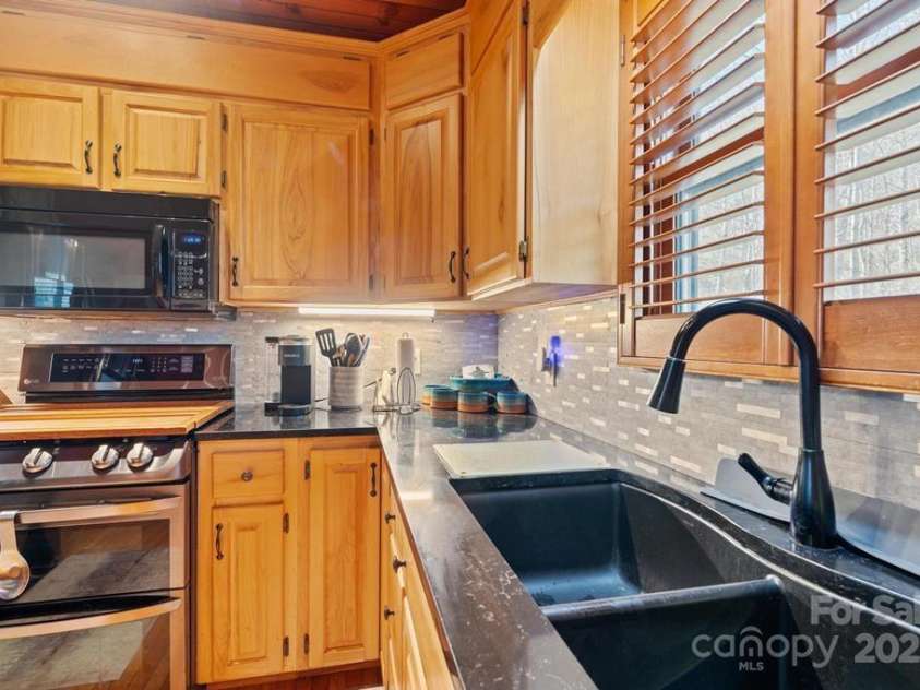 825 Posey Blanton Road, Sylva, NC 28779.  MLS# CAR4237679, YatesRealty ID 6159. 