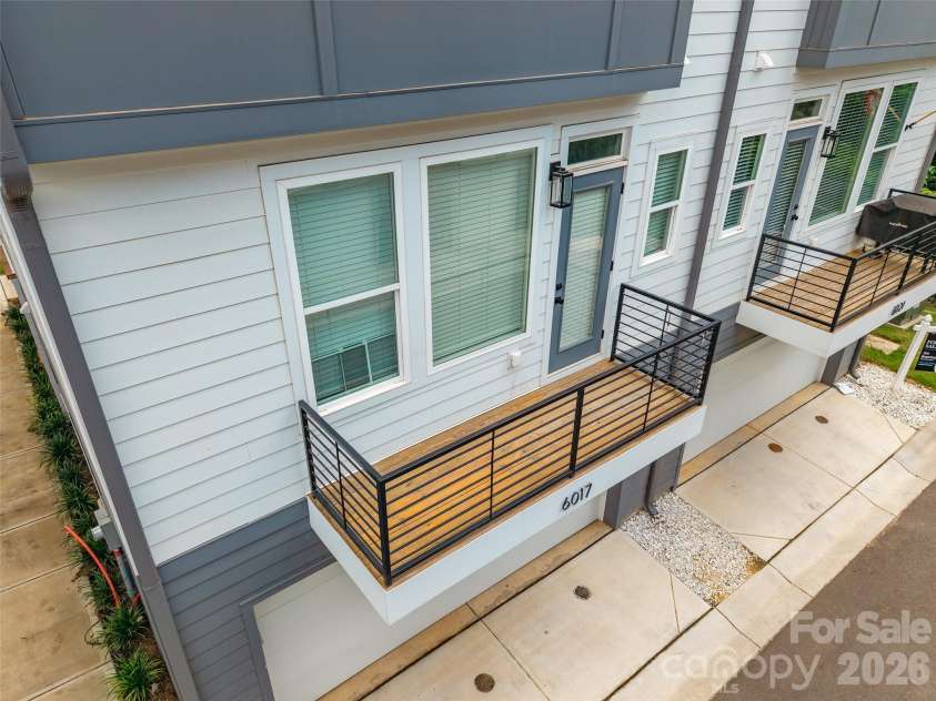 6017 Irwins Branch Drive, Charlotte, NC 28217.  MLS# CAR4349168, YatesRealty ID 6164. Balcony off dining area