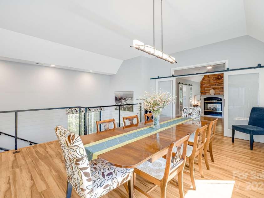 1387 Woods Ammons Road, Mars Hill, NC 28754.  MLS# CAR4303363, YatesRealty ID 6175. Dining view off kitchen and into Primary office - Barn Doors