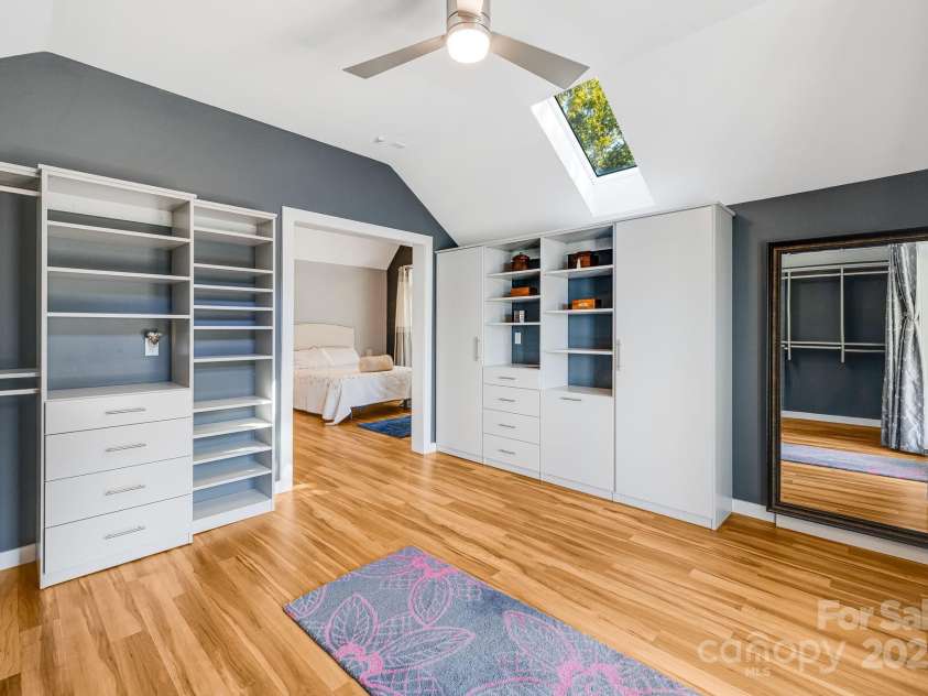 1387 Woods Ammons Road, Mars Hill, NC 28754.  MLS# CAR4303363, YatesRealty ID 6175. Extra-large primary wall in closet - Hidden safe behind mirror