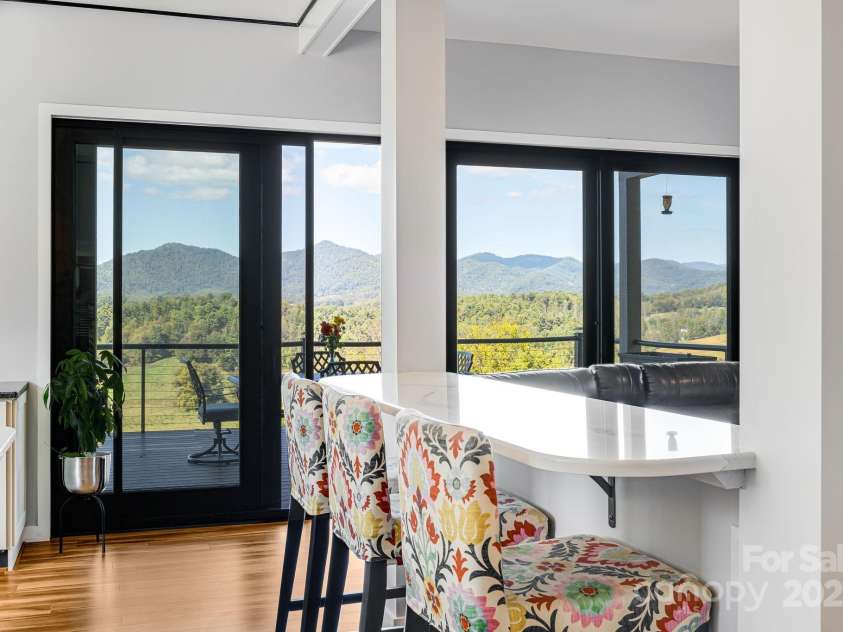 1387 Woods Ammons Road, Mars Hill, NC 28754.  MLS# CAR4303363, YatesRealty ID 6175. Kitchen Island and views of Terrace