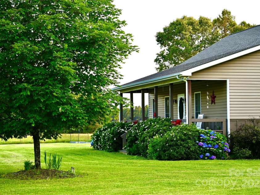 660 Scoggins Road, Rutherfordton, NC 28139.  MLS# CAR4221300, YatesRealty ID 6178. Rocking Chair Front Porch~~