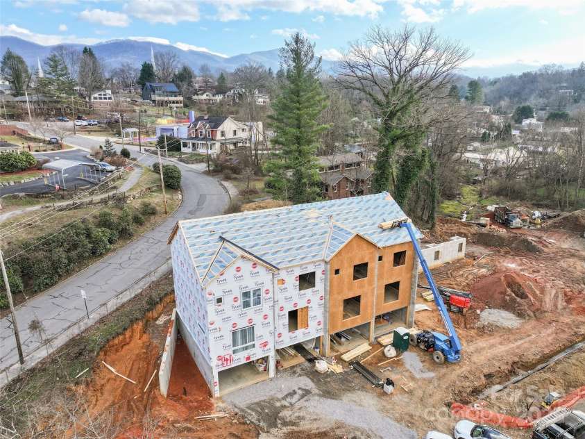 41 Richland Street, Waynesville, NC 28786.  MLS# CAR4330949, YatesRealty ID 618. Aerial with view of Waynesville in the distance.
