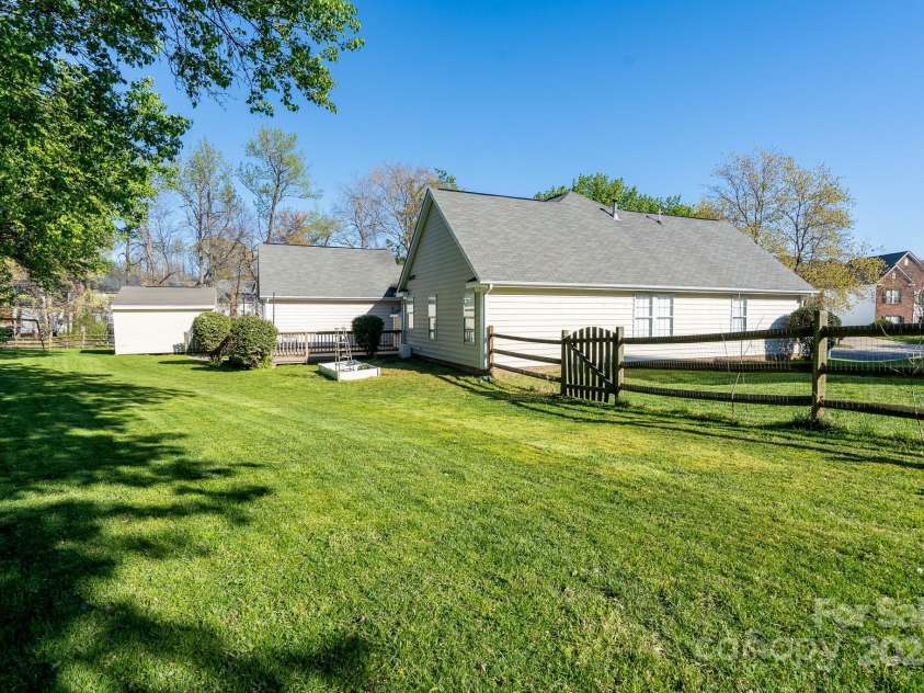 6111 Tesh Court, Charlotte, NC 28269.  MLS# CAR4239195, YatesRealty ID 6183. Large back deck overlooks private yard